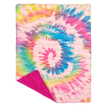 puffy quilted blanket with a coloful tie-dye pattern with solid bright pink backside