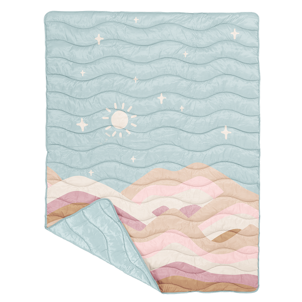 puffy quilted blanket in a with a light blue sky with the sun and stars and different shades of browns and pinks as the hills along the bottom.