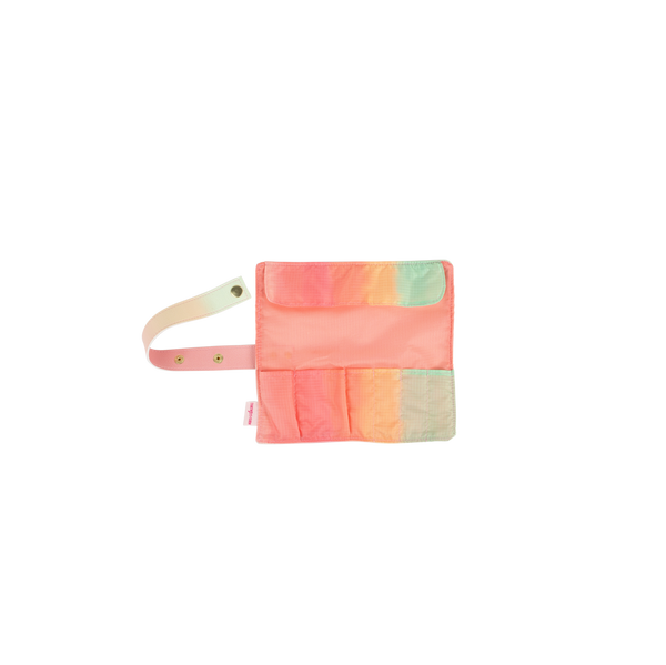 Small TOOTsie roll travel pouch open with solid peach interior and gradient colored pockets