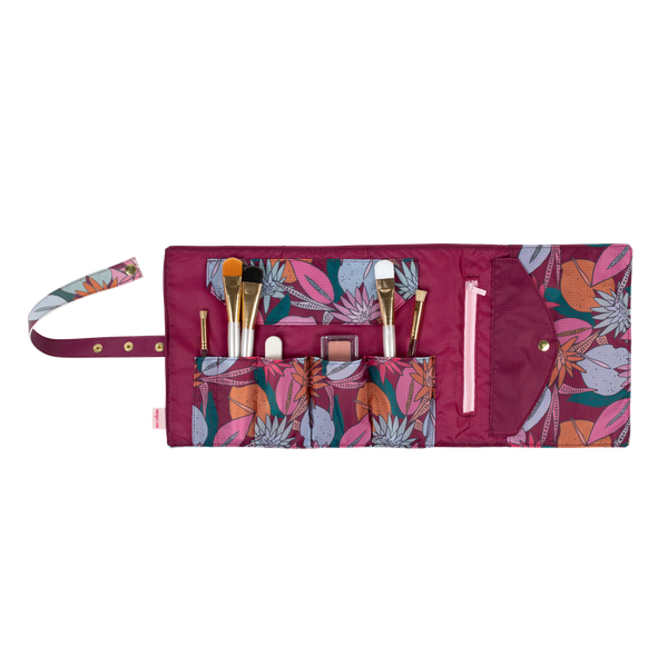 A multicolored jewel-toned, floral TOOTsie Roll roll-up bag. Bag is in Large and is good for holding stationary and/or cosmetic tools.A multicolored jewel-toned, floral TOOTsie Roll roll-up bag. Bag is in Large and is good for holding stationary and/or cosmetic tools.