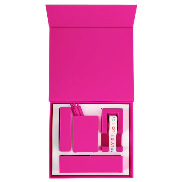 A pink desk set with a tape dispenser, two different desk organizers, and a stapler.