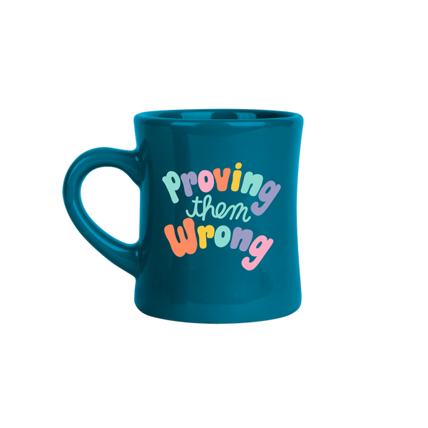 Dark blue color old school retro diner mug with colorful "proving them wrong" print?id=28589369295029