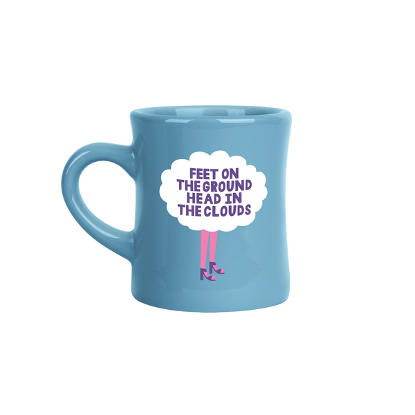 blue old school diner mug with girls legs in pink stockings with purple heels with a white cloud above her legs saying in purple "feet on the ground head in the clouds"