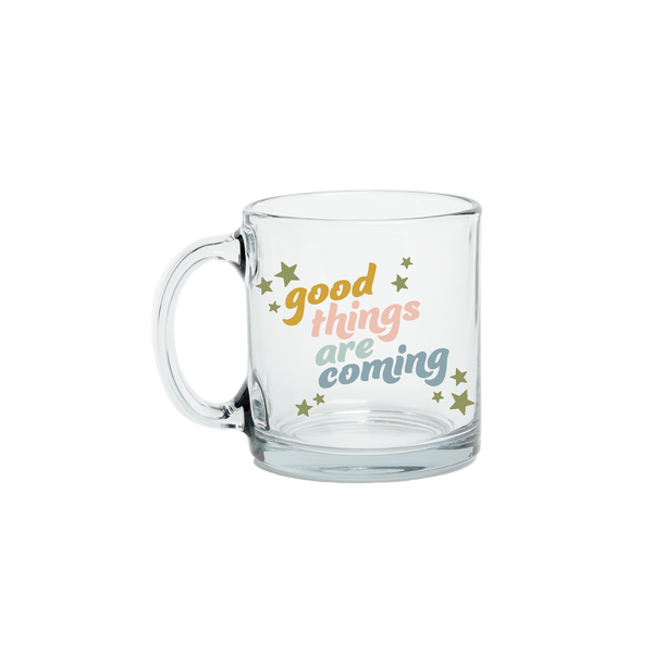 A clear glass mug with the phrase "good things are coming" printed on.