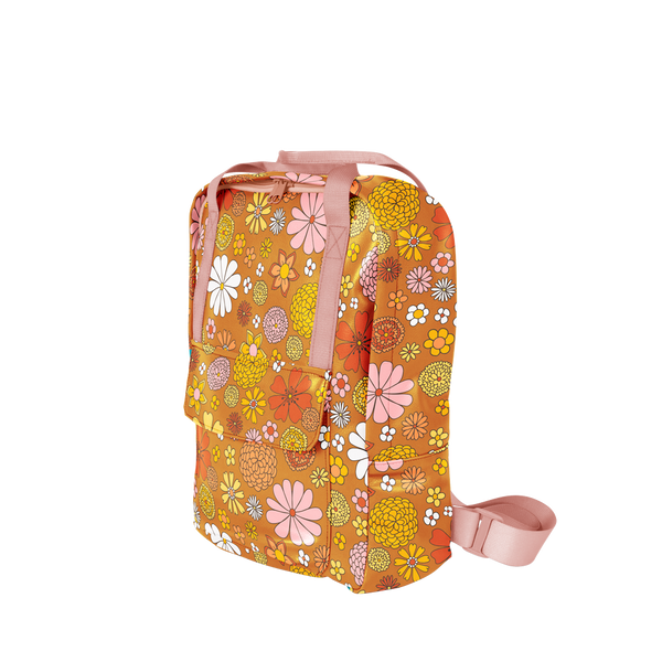 Multicolored flowered printed on an orange backpack with pink straps. Backpack is vegan leather and has a front zipper pocket.