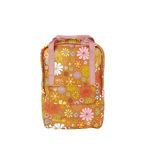 Multicolored flowered printed on an orange backpack with pink straps. Backpack is vegan leather and has a front pocket.
