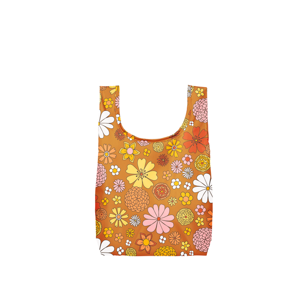 A burnt orange tote with yellow, pink, white and orange flowers.