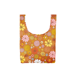 A medium, burnt orange reusable tote with yellow, white, pink and multi-colored flowers.