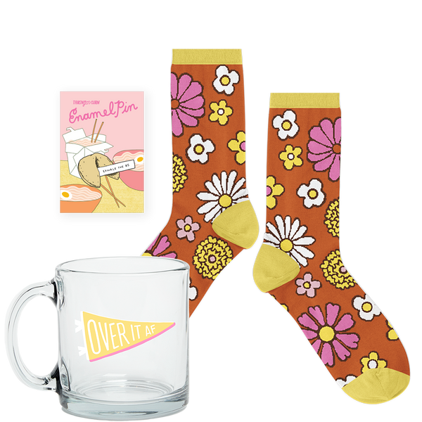 Over it AF kit with glass coffee mug, retro floral socks, and an enamel pin
