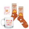 Naughty Mug Kit with glass coffee mug, sassy socks, and an enamel pin