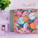 Multicolored jewel tones laptop sleeve with floral design.
