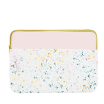 White paint splatter print laptop sleeve with blush pink trim, a gold zipper, and 15 inch size.