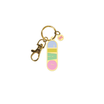 green key chain that says "CIAO" in multi-color letters; gold key ring attached