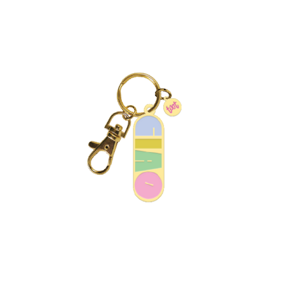 green key chain that says "CIAO" in multi-color letters; gold key ring attached