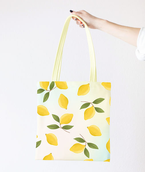 girl holding a cute tote bag with lemons