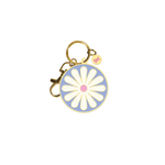 Round blue keychain with white daisy in middle; gold key ring attached