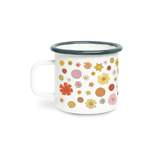 A white campfire mug with yellow, orange, coral, yellow, pink and white flowers spread all around the mug.