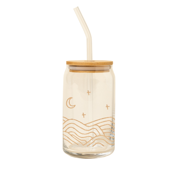 Can glass with glass straw and bamboo lid with a wrap around image in gold of hills and moon and stars