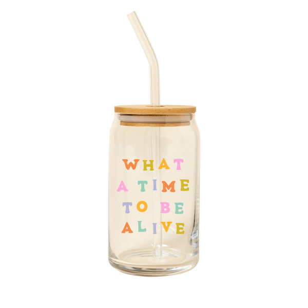 A 16 oz can glass with a decal that reads "WHAT A TIME TO BE ALIVE" in multi-color font.