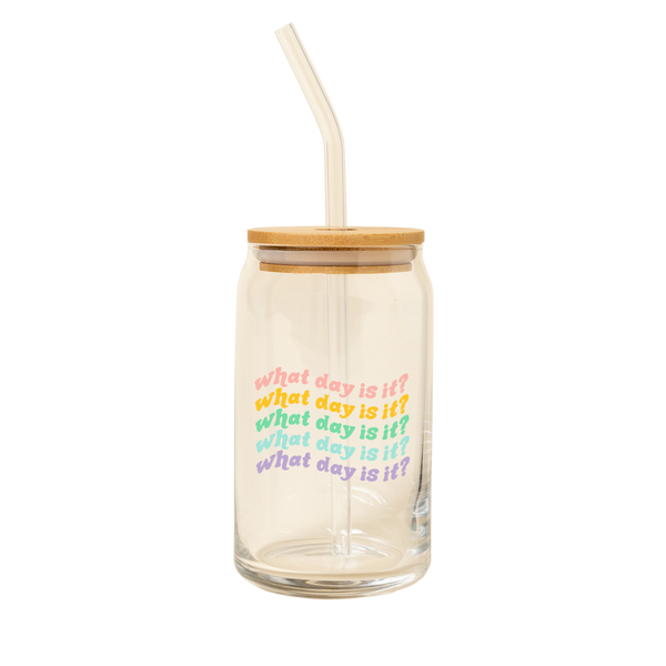 A 16 oz can glass with a glass straw; "what day is it?" is printed on and repeats 5 times, each in a different color font.