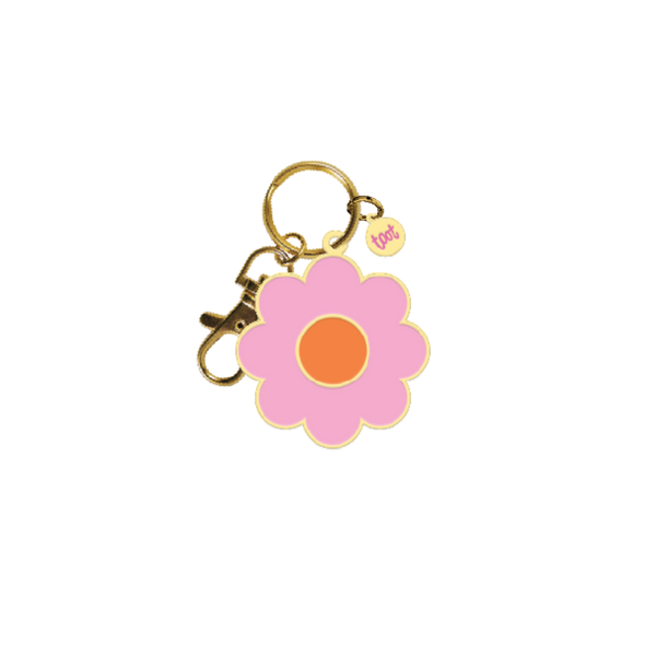 Pink daisy with orange middle key chain; gold key ring attached