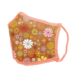 A tan-brown face mask with a peach colored trim. Tan-Brown part of the mask has multicolored and differently designed flowers.