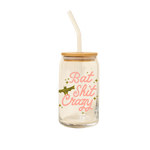 16 oz can glass with bamboo lid and glass straw with light pink lettering saying "bat shit crazy" and olive green bat and sparkle stars.