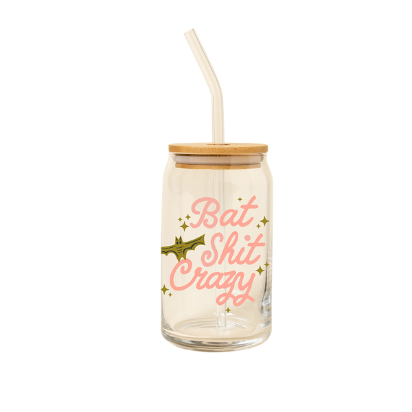 16 oz can glass with bamboo lid and glass straw with light pink lettering saying "bat shit crazy" and olive green bat and sparkle stars.