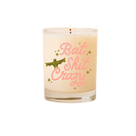 Candle rocks glass with text that reads "Bat Shit Crazy" in pink font; olive colored animated bat and minimalist sparkle stars surround the text