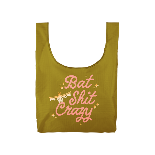 olive green compact reusable tote bag with pink lettering saying "Bat shit crazy" with yellow to white ombre bat with sparkle stars. 