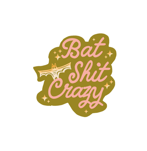 Olive green sticker with light pink lettering saying "bat shit crazy" with ombre yellow to white bat and star sparkles.