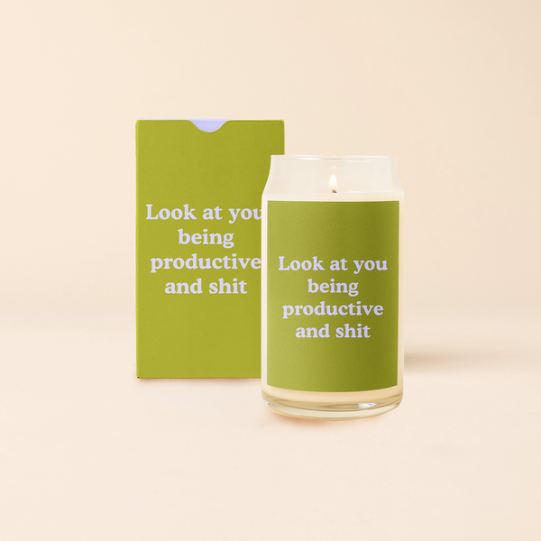 16 oz candle can glass with olive green decal and text that reads "Look at you being productive and shit" in light blue font. Olive green box with same design sits behind candle.