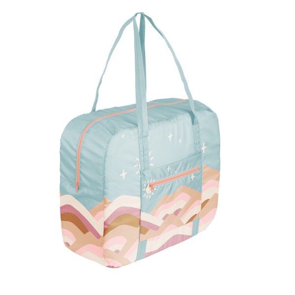 Large ripstop travel bag in mint with a mountain scene in pink, taupe, brown, tan, and white. The bag has handles and folds into its own pouch.