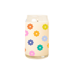 A 16 oz. candle with multicolored daisies printed all around the candle.