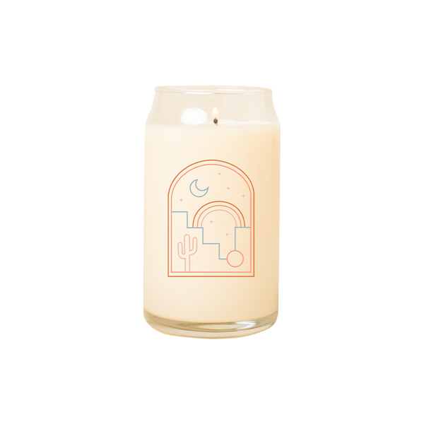 A 16 oz. candle with a Desert Nights design printed on front.