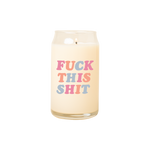 A 16 oz. candle with Fuck This Shit printed on in multicolored lettering.