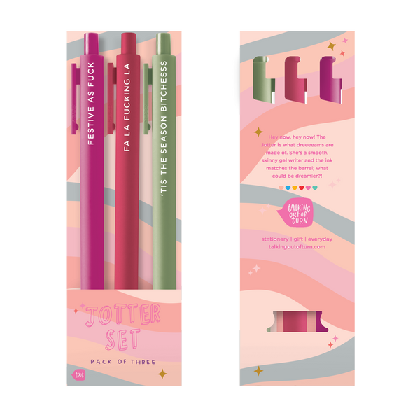 Pack of 3 jotter pens; pink with "FESTIVE AS FUCK" in white lettering, maroon with "FA LA FUCKING LA" in white lettering, olive with "'TIS THE SEASON BITCHESSS" in white lettering. Pens are in a multi-color wavy design packaging.