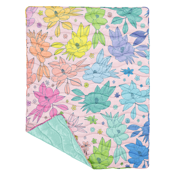 A multicolored, quilted floral puffy blanket with a solid light blue back side. Flowers are varying in shape and size.