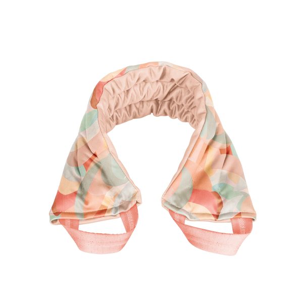 A multicolored, abstract moon designed spa neck wrap. Peach interior color and handles.