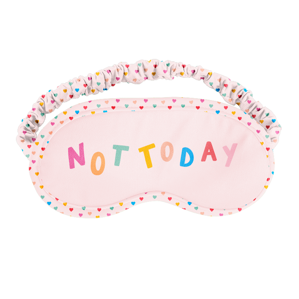 a pink sleep mask with different colored tiny hearts that says not today 