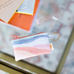 Small pouch with key ring, perfect for all your cards or change, pouch has watercolor stripes reminiscent of the sunset