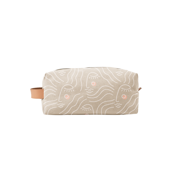 zen ladies doppleganger pouch in tan with a white outline silhouette drawing of a woman's face with blush colored cheeks