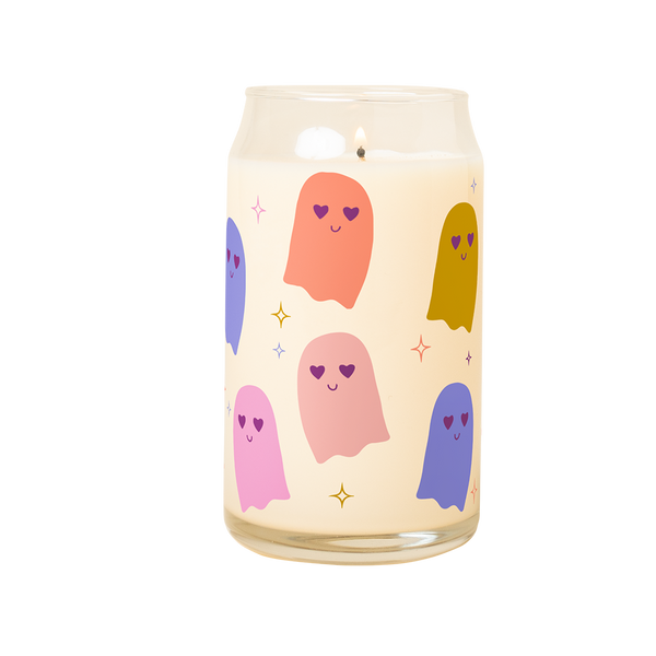 A 16 oz candle can glass with illustrations of multi-color ghosts that wrap around the glass, multi-color sparkle-stars surround the ghosts.