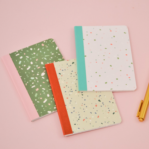 Three mini notebooks with different color terrazzo