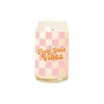 A 16 oz. candle with a pink checkered print design and the phrase "Trust your Vibes" printed on.