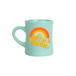  A mint diner mug with "Don't be a dick" in shades of orange on the front. A rainbow arch is printed on top of the phrase.