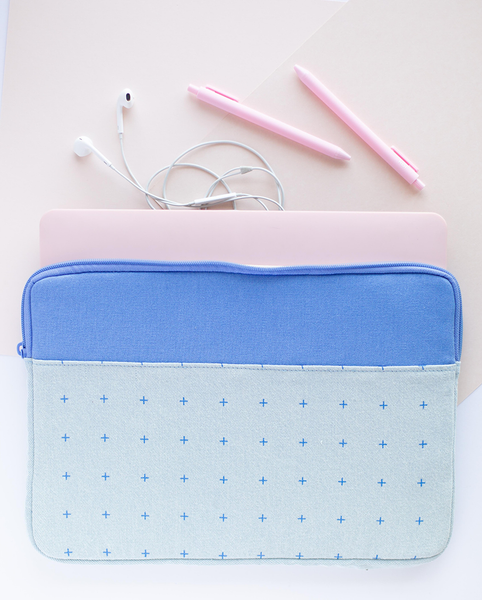 Plus 1 Canvas Laptop Sleeve is a cute laptop sleeve in light denim with blue plus pattern in 13 inch size with a laptop inside and three jotter pens outside