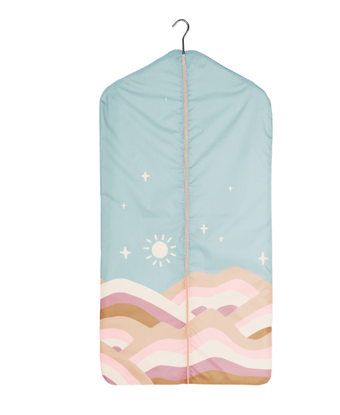 adult size garment bag with blue sky and pastel striped hills and stars. Bag is secured with a peach zipper that reaches all the way to the bottom.