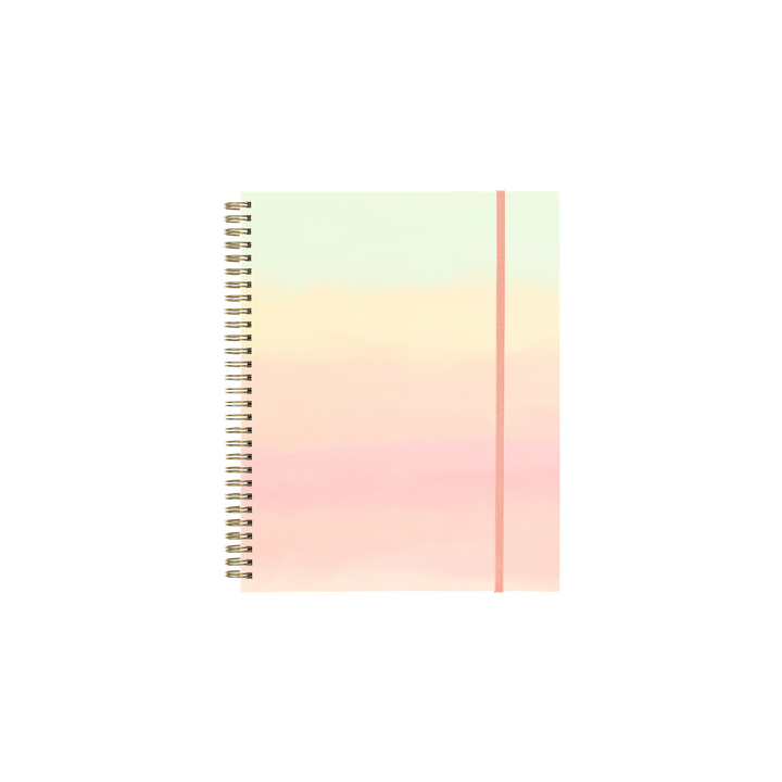 Rainbow ombre notebook planner with a spiral spine.