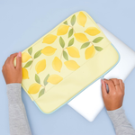 yellow laptop sleeve with lemons and blue zipper